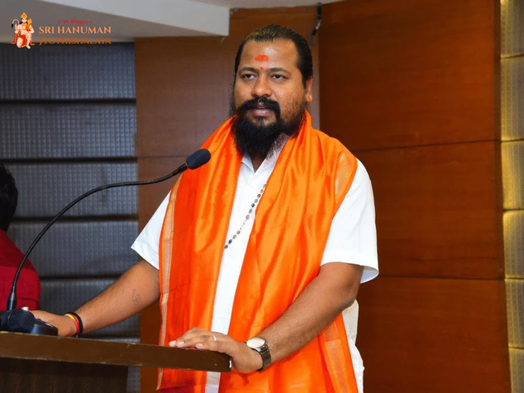 Pandit Sri Pandu Ranga Shastri Ji speaking at an event